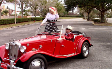 Show Band on Wheels is the ultimate 50s band in Sarasota specializing in 50s entertainment, Oldies band, Sock hop, atmosphere entertainment, parades, and streetmosphere entertainment, interactive entertainment, as a oldies duo for 50s theme entertainment, and sock hop parties with a live band look no further than Show Band on wheels for your Grease theme party entertainment with a muscle car or antique car for your event. DJ on wheels in a 1950s muscle car. 